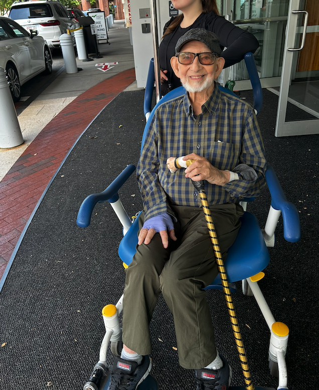 My Papy being discharged from the hospital after heart surgery, smiling and ready to continue his recovery.