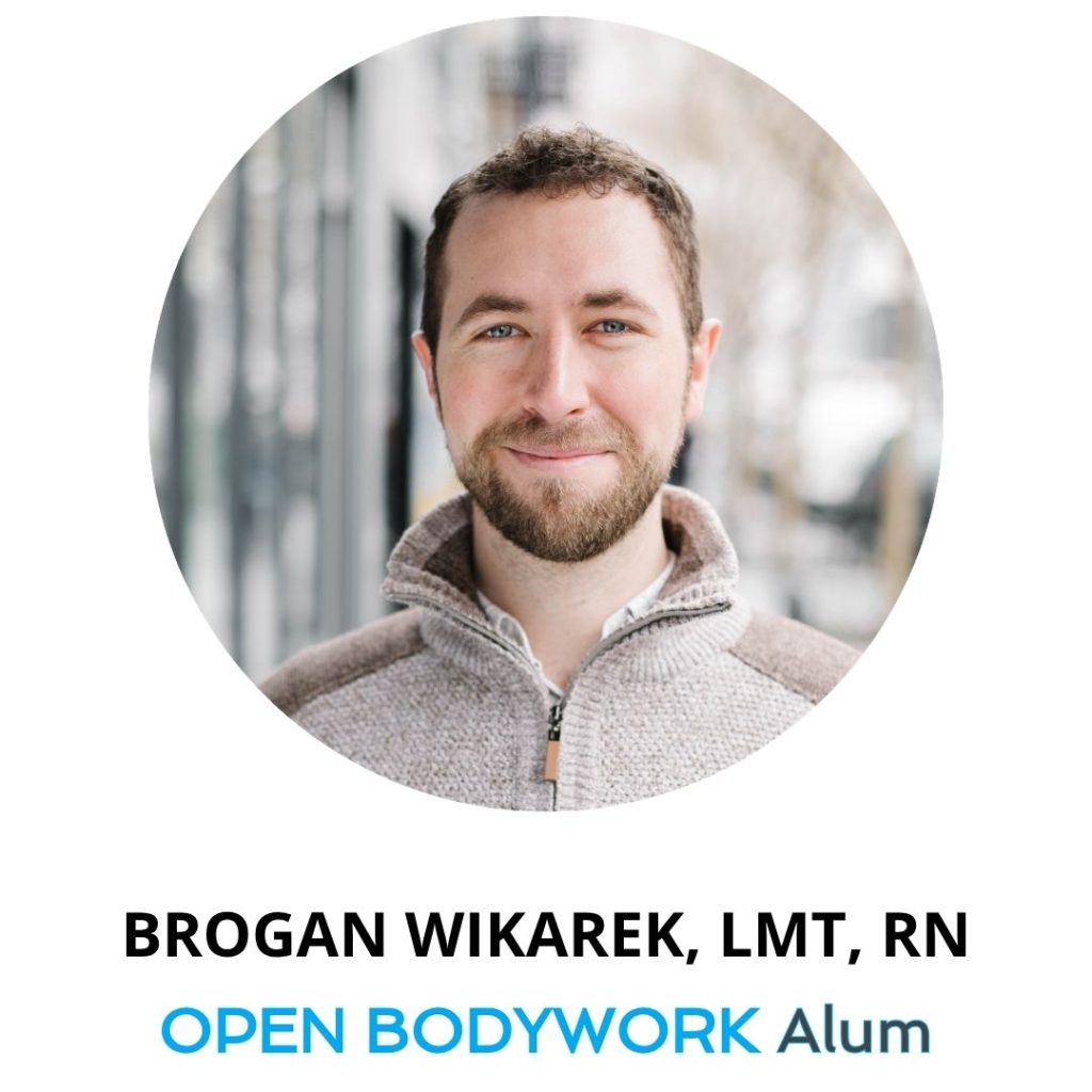 Brogan Wikarek, LMT, RN, OPEN Bodywork student of Tania Velasquez, smiling with a quarter-zip sweater
